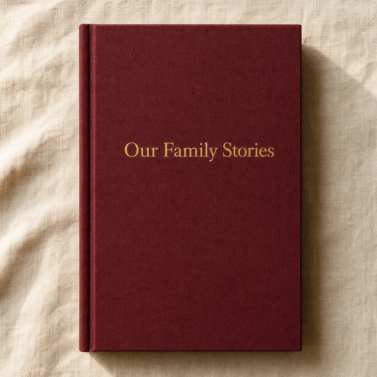 Closed burgundy Storykept memoir cover with gold foil title